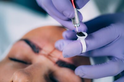 Beautician Doing Eyebrow Correction